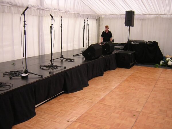 Setting Up Stage Under Marquee — Party Supplies in Wagga Wagga, NSW